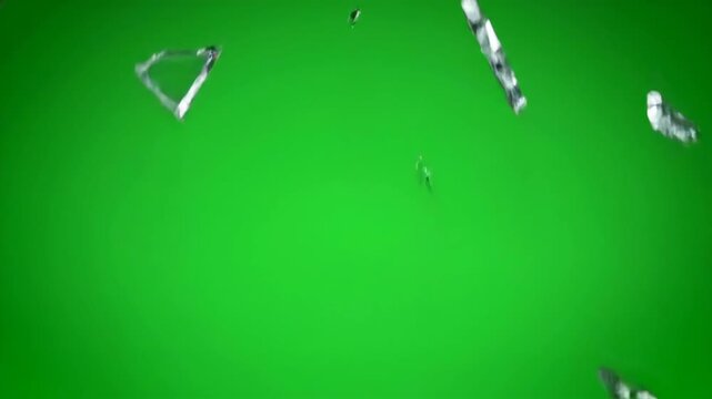 Dynamic explosion of a glass pane shattering outwards on green screen background high speed, vfx, production