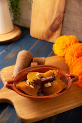 Calabaza en Tacha. Spiced Candied Pumpkin. Mexican dessert whose main ingredients are pumpkin and piloncillo, also known as Chacualole or Dulce de Calabaza, widely used in Day of the Dead offerings.