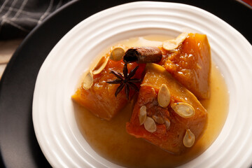 Calabaza en Tacha. Spiced Candied Pumpkin. Mexican dessert whose main ingredients are pumpkin and piloncillo, also known as Chacualole or Dulce de Calabaza, widely used in Day of the Dead offerings.