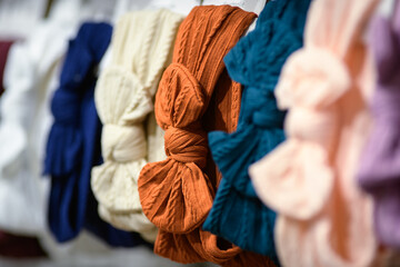 Multiple hair bands with bows for sale at a street market - horizontal