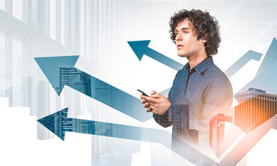 Confident young man holding smartphone, surrounded by rising arrows, modern office background, city buildings overlay, concept of business growth