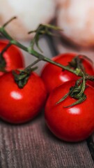 Fresh ripe tomatoes on a rustic wooden surface