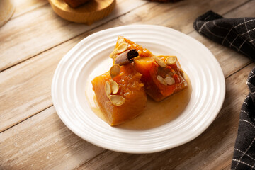 Calabaza en Tacha. Spiced Candied Pumpkin. Mexican dessert whose main ingredients are pumpkin and piloncillo, also known as Chacualole or Dulce de Calabaza, widely used in Day of the Dead offerings.