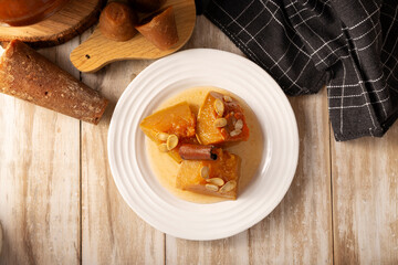 Calabaza en Tacha. Spiced Candied Pumpkin. Mexican dessert whose main ingredients are pumpkin and piloncillo, also known as Chacualole or Dulce de Calabaza, widely used in Day of the Dead offerings.
