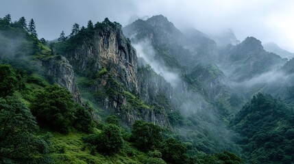 Misty Mountain Cliffs in Enshi City, Hubei Province. Rugged Textures and Green Slopes Emerge from the Fog in a Breathtaking Natural Scene.
