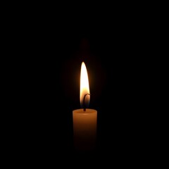 A candle is lit in a dark room. The candle is the only source of light in the room. 