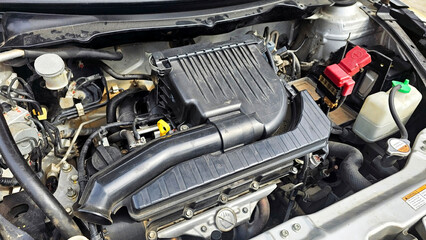 Fototapeta premium Engine's Intricacies Unveiled: A close-up view of a car engine's core components, showcasing its technical design and mechanical prowess.