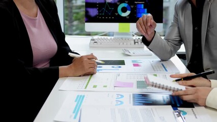 Professional business team analyzing marketing performance, collaborating on project while reviewing data charts and graphs in modern corporate office setting - Powered by Adobe