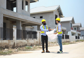Architects and engineers visit the site to observe the construction progress according to the...