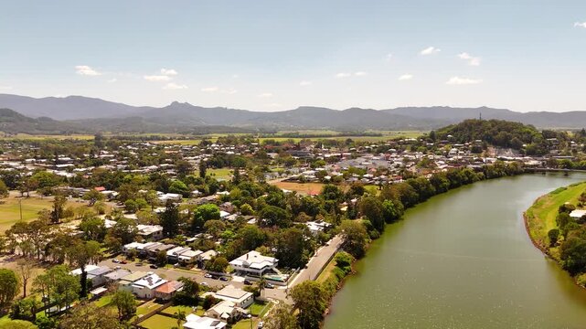 Drone footage heading north along the Tweed River with Murwillumbah on the left