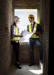 Architects and engineers discuss teamwork, construction, and happiness for real estate, complete with plans, inspections, and hard hats at the construction site.