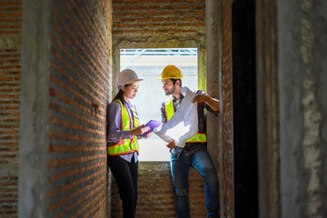 Architects and engineers discuss teamwork, construction, and happiness for real estate, complete with plans, inspections, and hard hats at the construction site.
