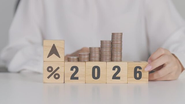 2026 New year with percentage change to UP and Down arrow with coin stack. Interest rate, GDP, stocks market, financial, deflation and Inflation, mortgage, debt, Loan and Economic Recession