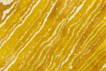 Yellow marble texture. Surface natural yellow marble with white veins, background, close-up, high resolution.