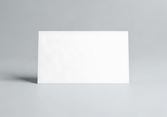 Fototapeta premium Minimalist design template: a crisp white card casting a floating shadow on a uniform surface