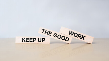 Keep up the good work, text is written on wooden blocks