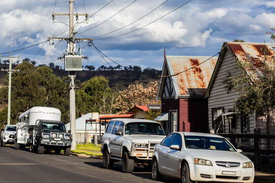Cars parked down roadside in Cassilis tiny country village in the Hunter Region of NSW