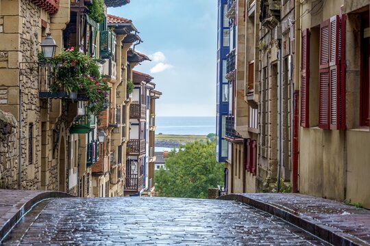 Colorful Historic Cobblestone Street and Ocean View in medieval old town Hondarribia, Basque Country