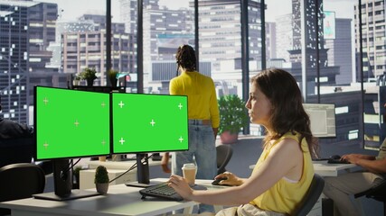 Developer using multi monitor isolated screen PC to create machine learning models that can process data to automate decision making processes. Woman programming using mockup computer, camera B