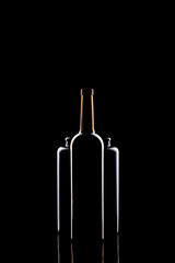 Still life with glass objects on a black background