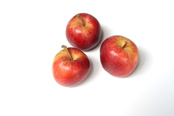 Group of Three Red Apples on White Background.
