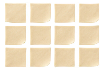 Fototapeta premium Pre-cut puff pastry squares arranged neatly in a plastic container.
