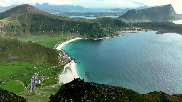 Experience breathtaking views of Mannen mountain overlooking Haukland beach in Lofoten, Norway.