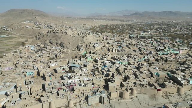 Ghazni Drone Aerial View of Historic medieval Citadel fortress , Street Traffic, City Buildings and Homes, Afghanistan