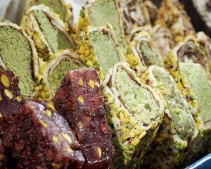 Several types of chocolate and pistachio Turkish delight at the market. Gluten-free oriental sweets. Lactose-free market.