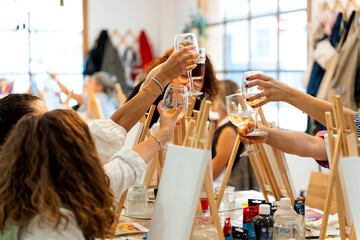Art & Wine workshop. People toasting at a creative painting workshop
