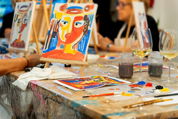 Art & Wine workshop. People enjoying wine and painting workshop