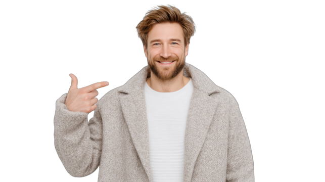 Cheerful man with curly hair wearing a textured grey coat and white sweater pointing to the side with a smile in a studio portrait with a transparent background