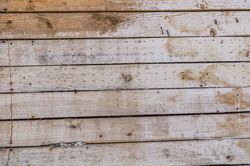 Obraz premium Detailed close up of rustic wooden planks with natural grain, rough texture, scratches, and weathered surface. Perfect background for design projects, vintage decor, carpentry, and creative artwork.