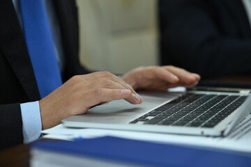 close up of a businessman working on laptop