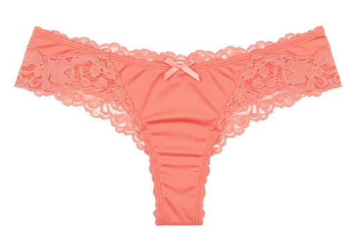 Isolated apricot thong panties with lace trim and satin ribbon bow, lingerie item