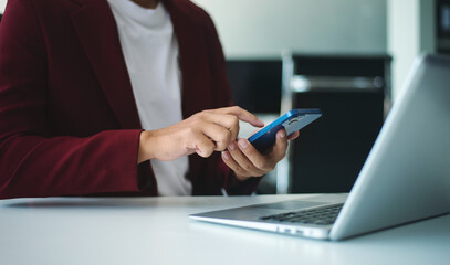businessman using a stylus with smart phone in office. Concept of smart technology, remote work