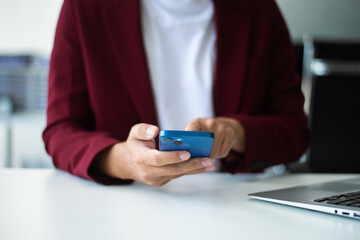 businessman using a stylus with smart phone in office. Concept of smart technology, remote work