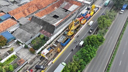 project work on the highway for drilling in the ground, installing large pipes, culverts