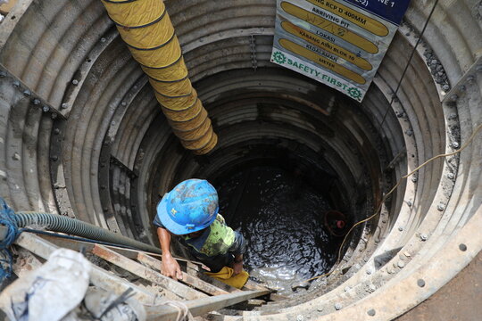 project work on the highway for drilling in the ground, installing large pipes, culverts