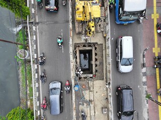 project work on the highway for drilling in the ground, installing large pipes, culverts