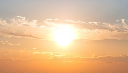 Obraz premium Glowing orb surrounded by wispy clouds in an open sky. Soft, warm hues illuminate the scene