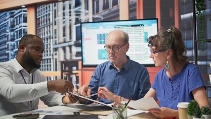 Mature couple receiving professional advice on retirement planning, discussing potential...