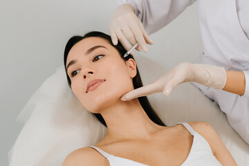 Full Face Botulinum Toxin Injection. Botulinum toxin therapy refines cheek contour. Aesthetic...