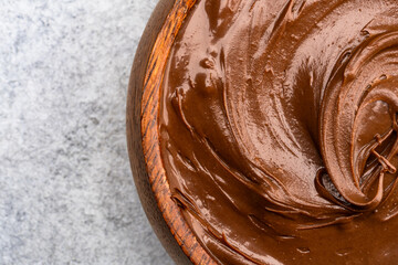 Cream chocolate in a bowl on a vintage background
