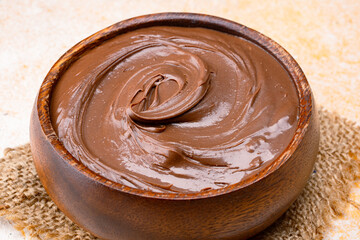 Cream chocolate in a bowl on a vintage background