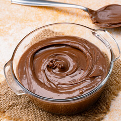 Cream chocolate in a bowl on a vintage background
