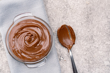 Cream chocolate in a bowl on a vintage background
