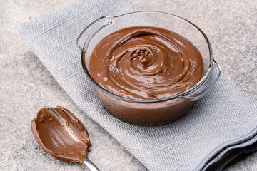 Cream chocolate in a bowl on a vintage background
