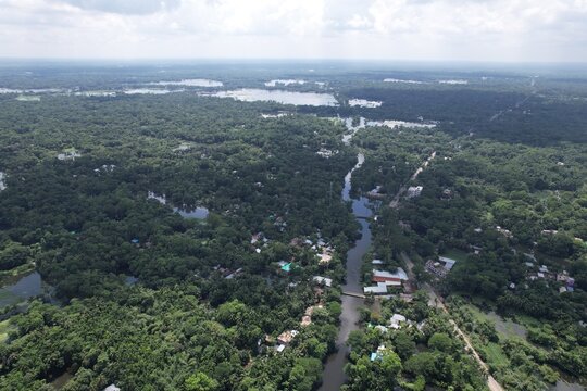 Aerial Panorama River Winding Through Green Landscape Villages Under Blue Sky Lush Vegetation Drone Photography Scenic Route