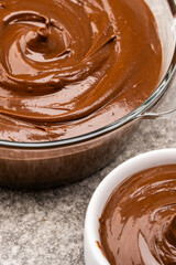 Cream chocolate in a bowl on a vintage background
